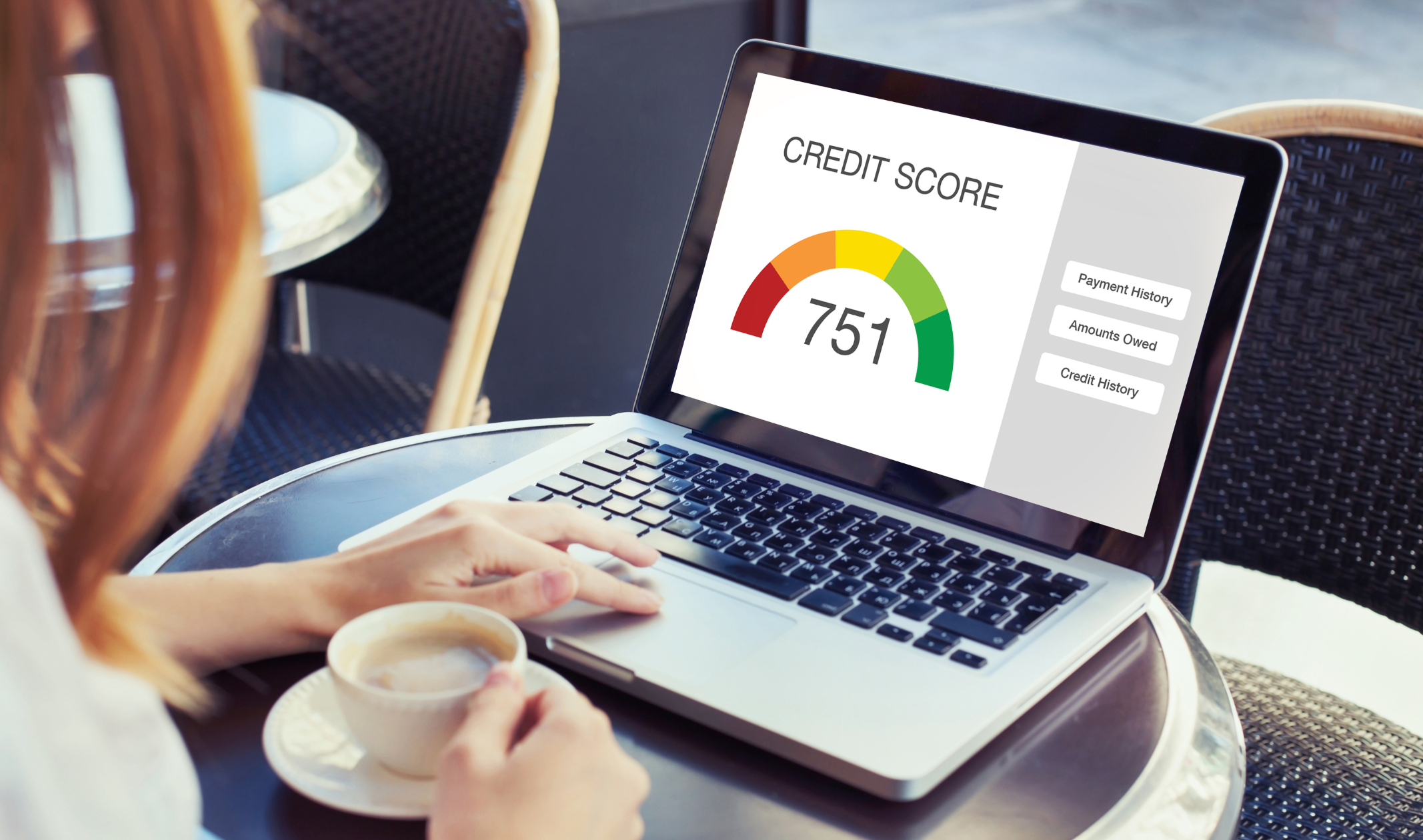 Person checking credit score on laptop from 3 credit bureaus
